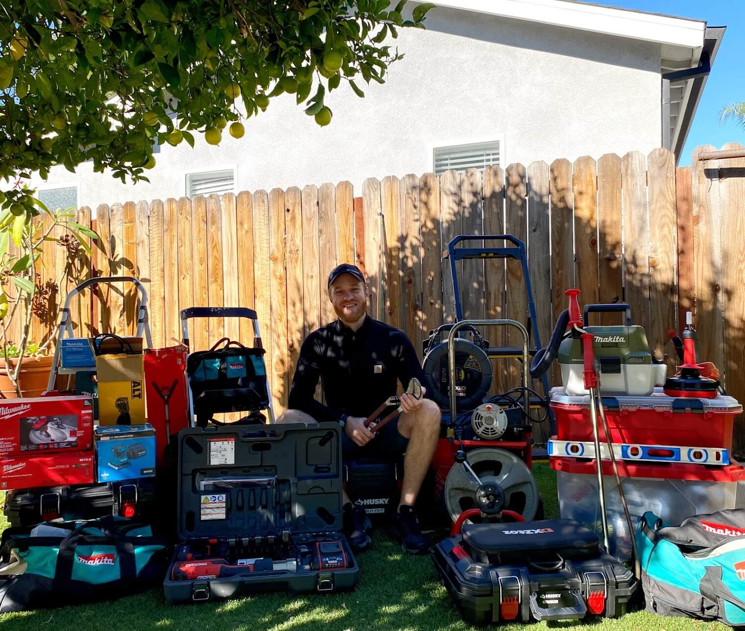 Professional plumber with equipment